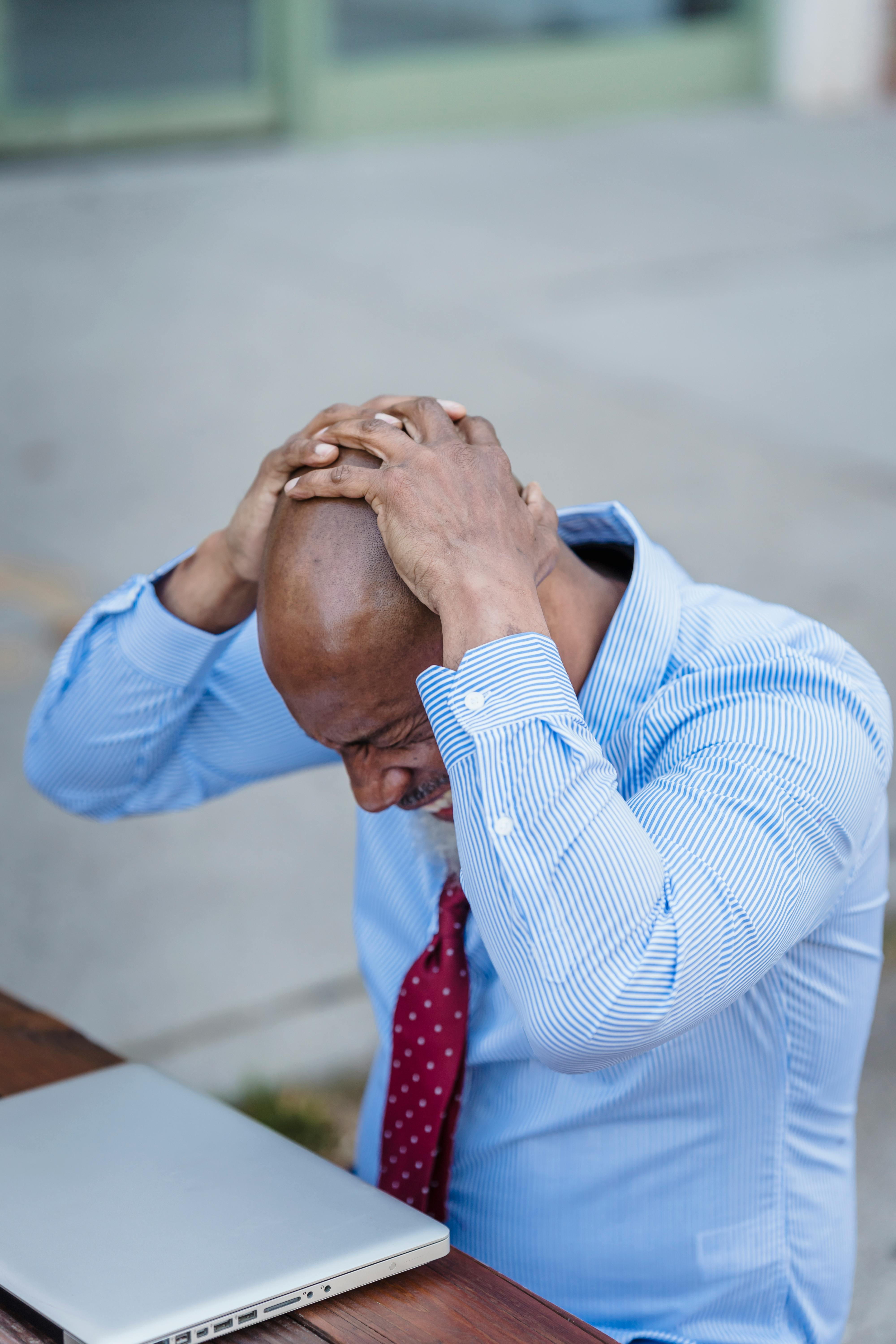 man holding his head