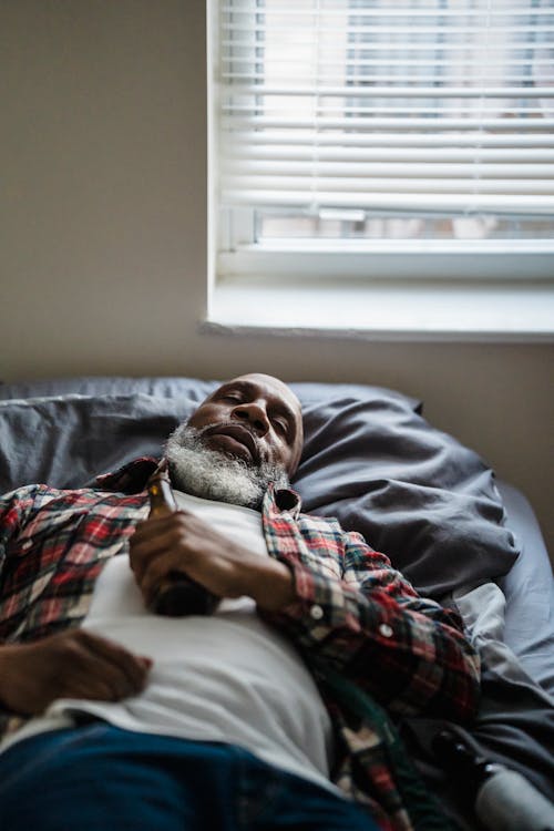 Old Man Sleeping with Beer Bottle