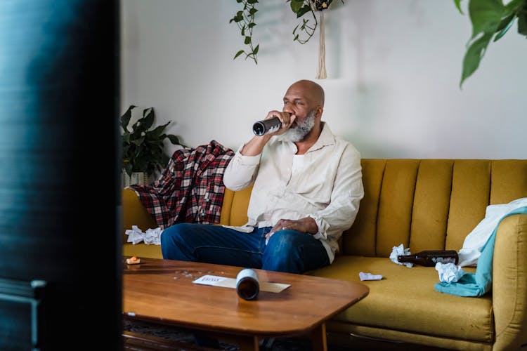 Alcoholic Sitting At Home Drinking Beer Watching TV