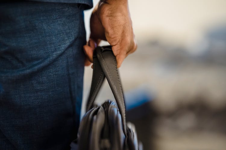 Close-up Of A Man Holding A Briefcase 