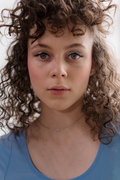 Free Portrait of a Curly Haired Woman Stock Photo