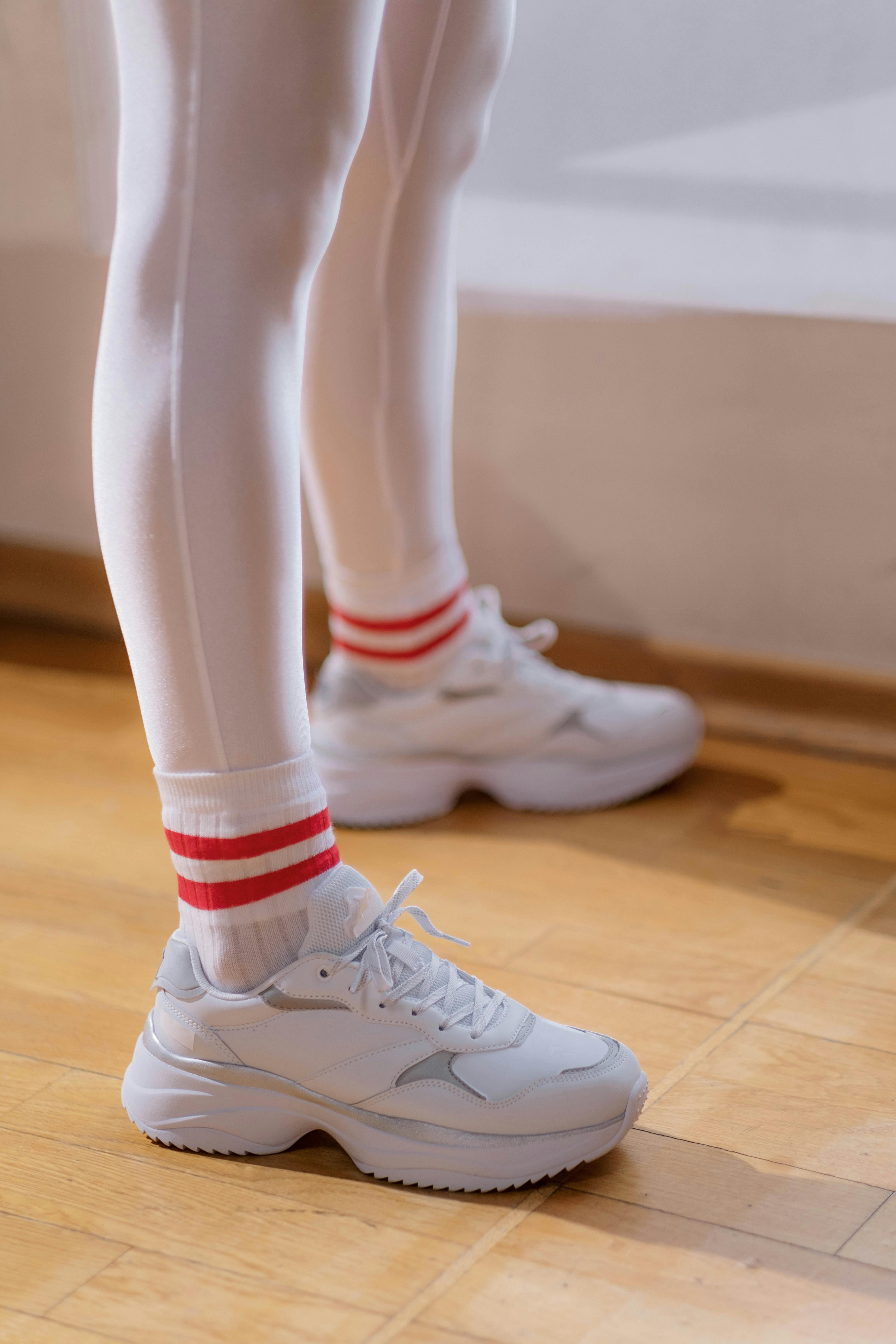 Reflection of a Woman Wearing Red Tights · Free Stock Photo