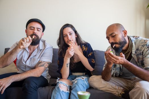 A Woman Sitting Between Bearded Men