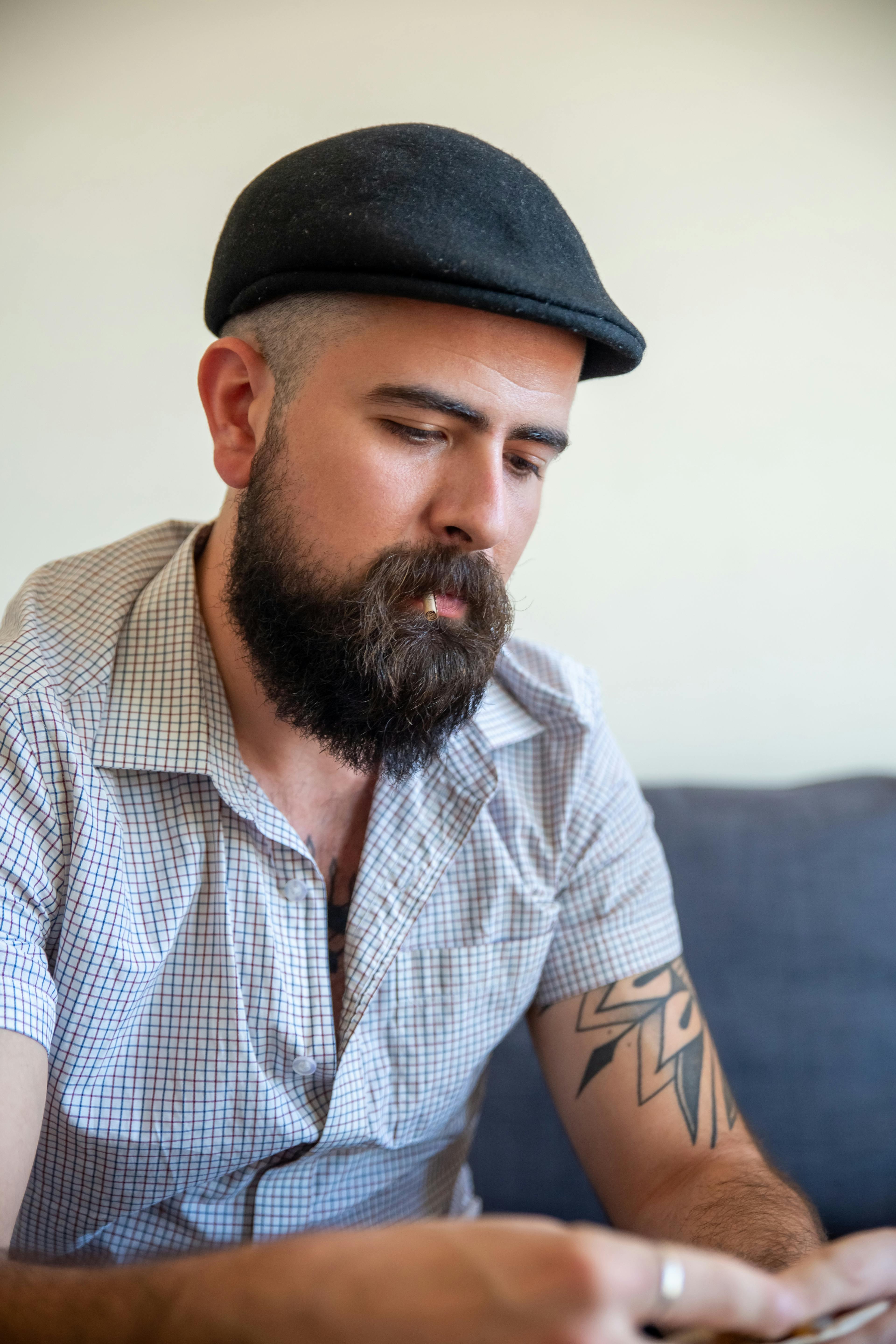 A Bearded Man with Flat Hat · Free Stock Photo