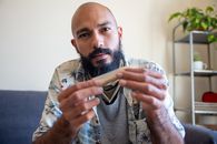 A Bearded Man Holding Paper
