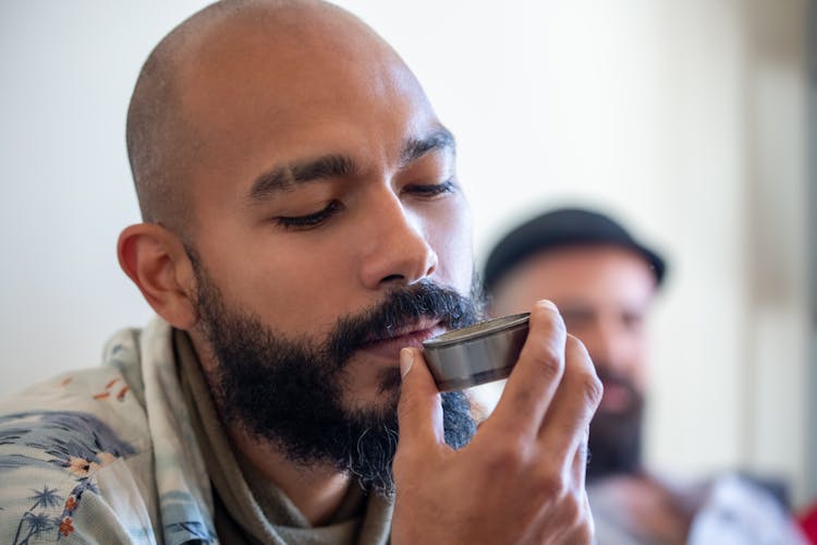 Bald Man With Beard Holding Small Silver Tray