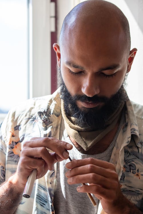 A Man Holding Cannabis 