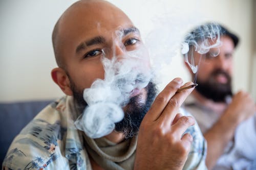 Bearded Man Smoking a Joint