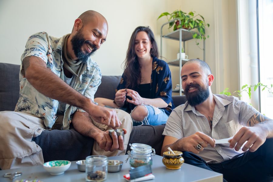 Friends sharing coffee and conversation together in a cozy living room