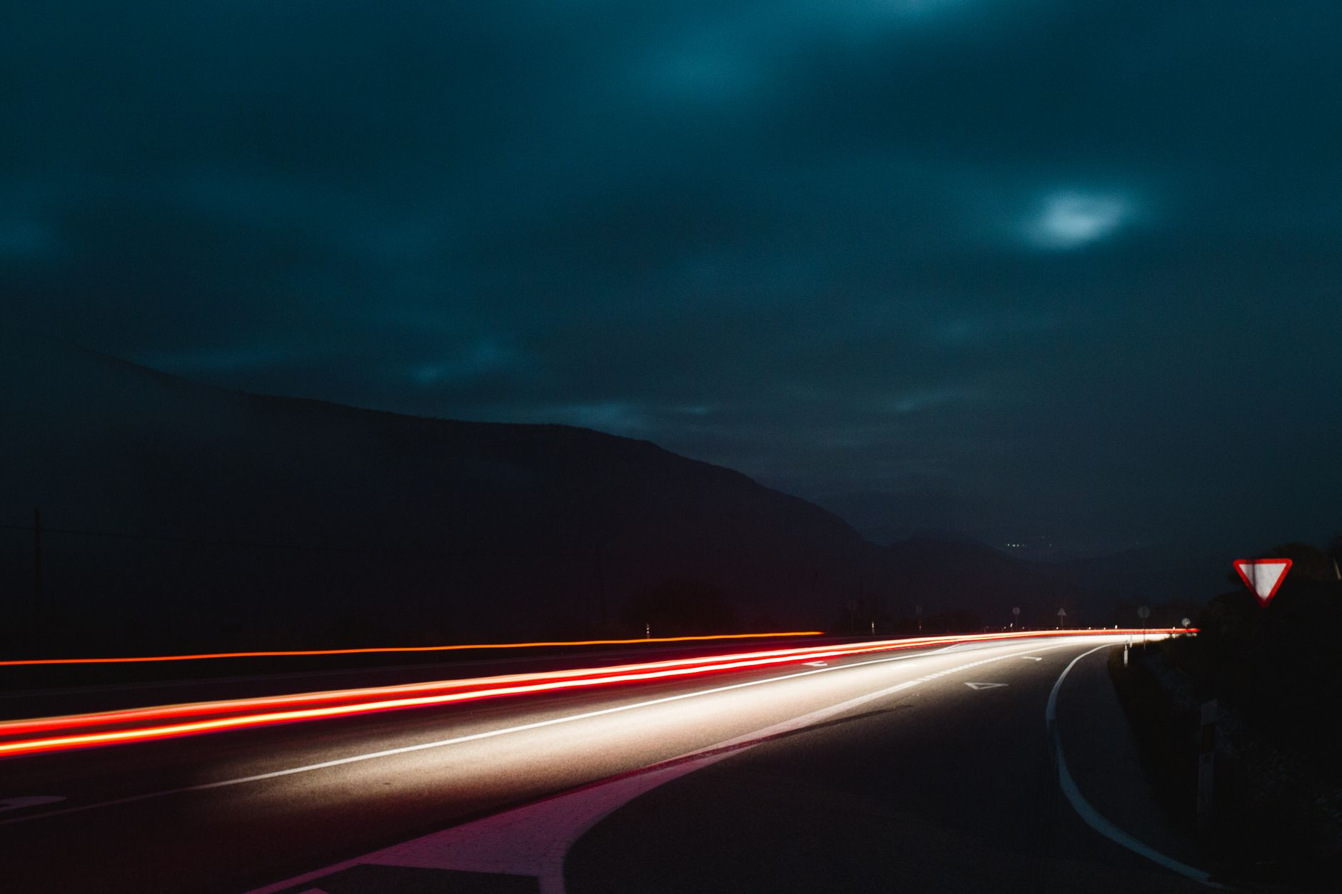 Night shot capturing long exposure light trails on a dark, curved highway.. pexels, night, shot