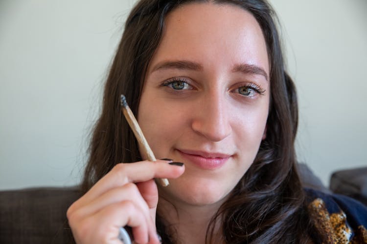 A Woman Smoking A Joint