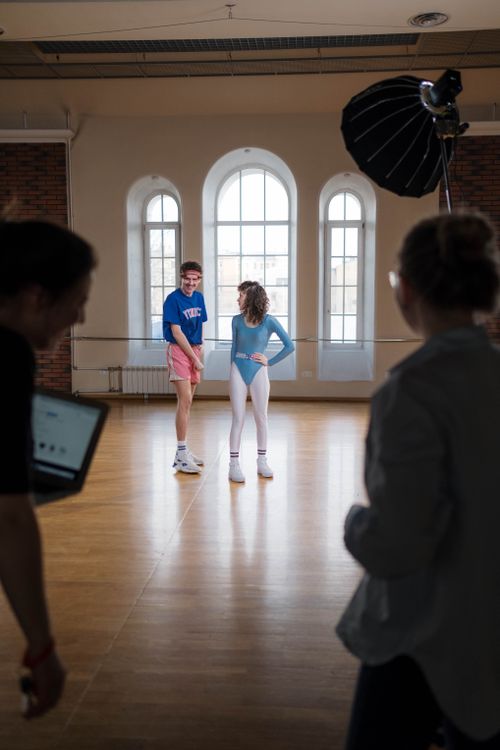 Free Capture of a retro dance studio scene with people in leotards, creating an 80s vibe. Stock Photo