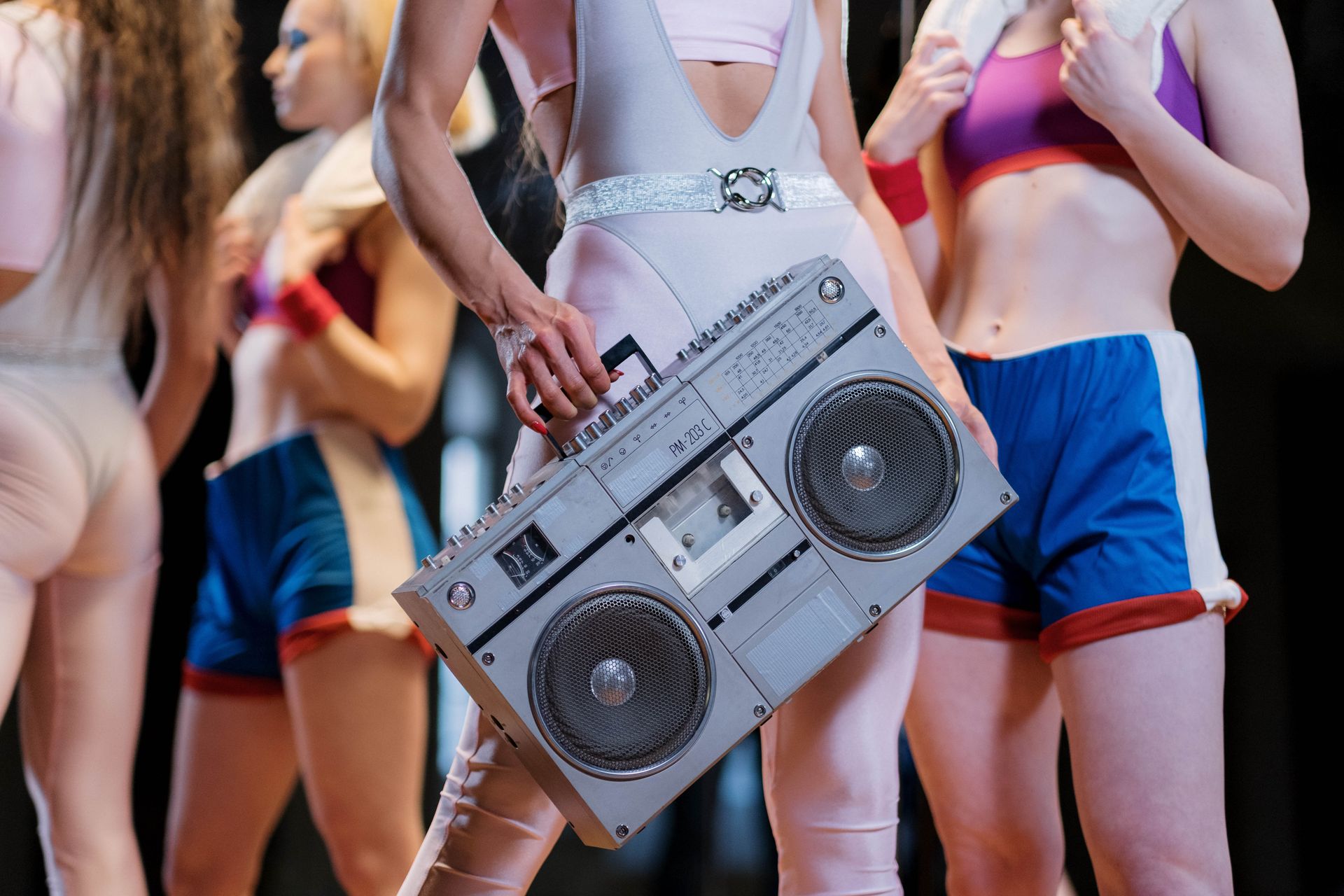 Close-Up Shot of a Person Holding a Boombox