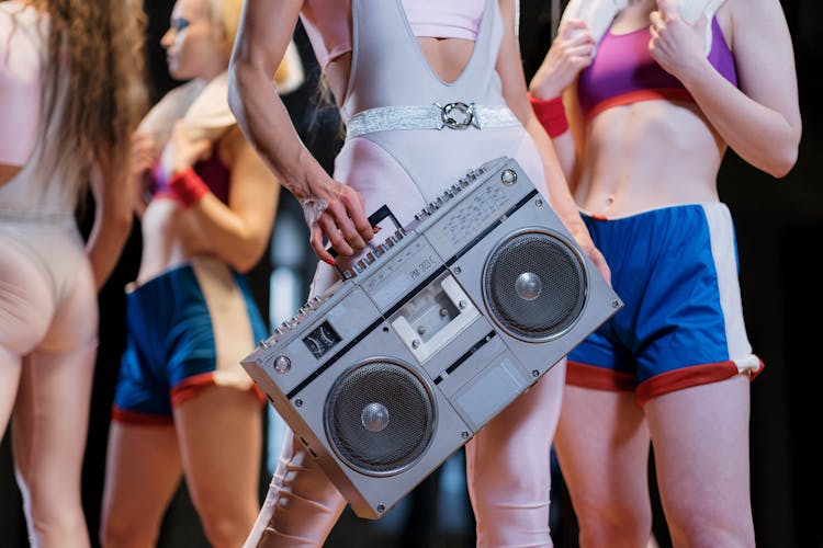 Close-Up Shot Of A Person Holding A Boombox