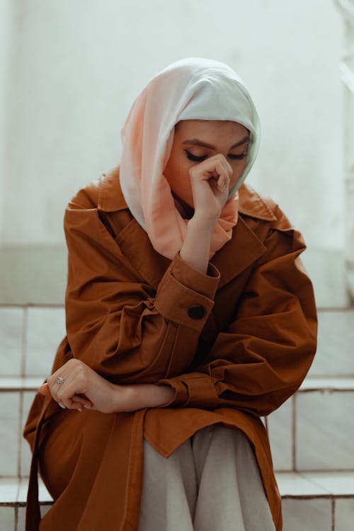 Woman Wearing Hijab Sitting on Stairs