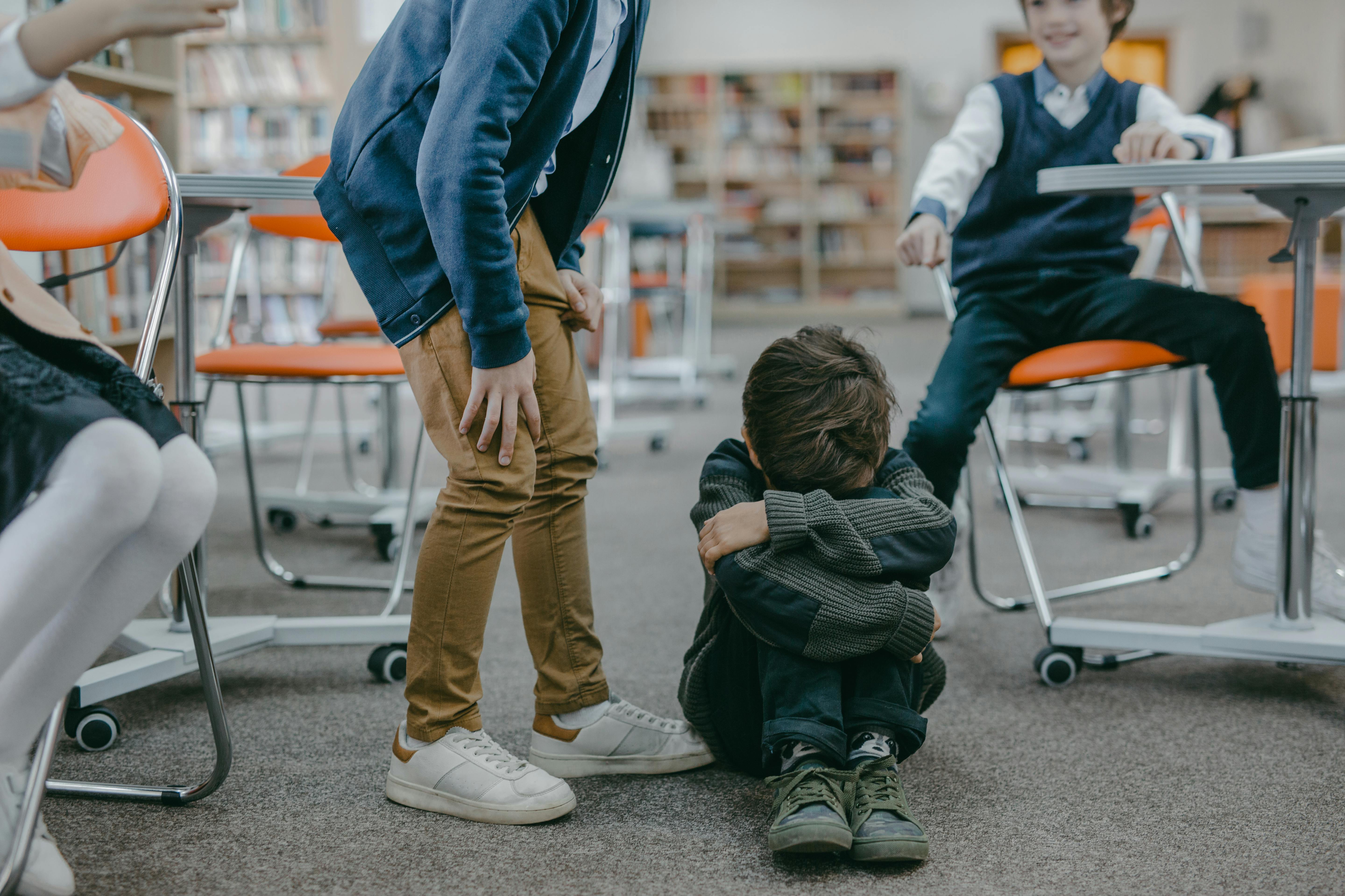 kids pointing and laughing bullying