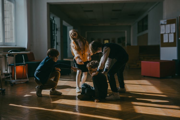 A Kid Getting Bullies By Classmates In School