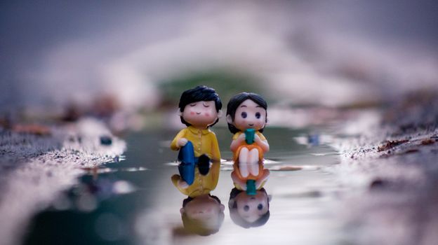 Figurines of a Man and a Woman in Water