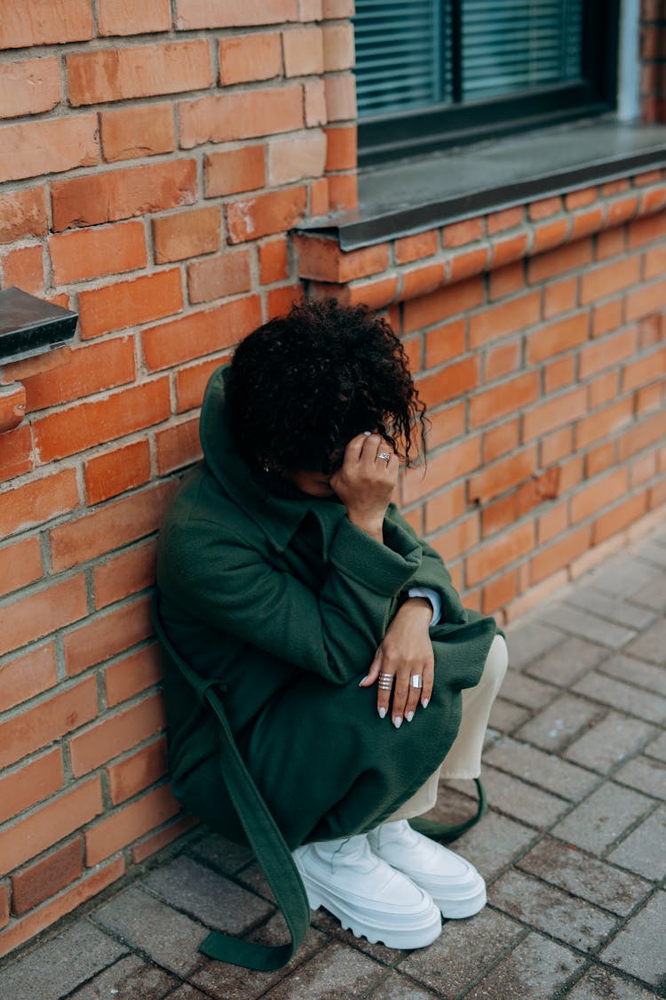 Woman In Green Coat Crying 