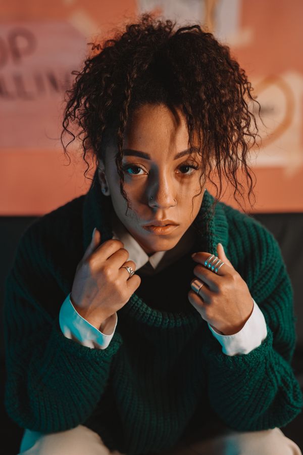 Woman in textured forest green sweater