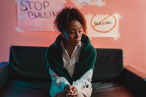 Free A Woman Sitting on the Couch Stock Photo