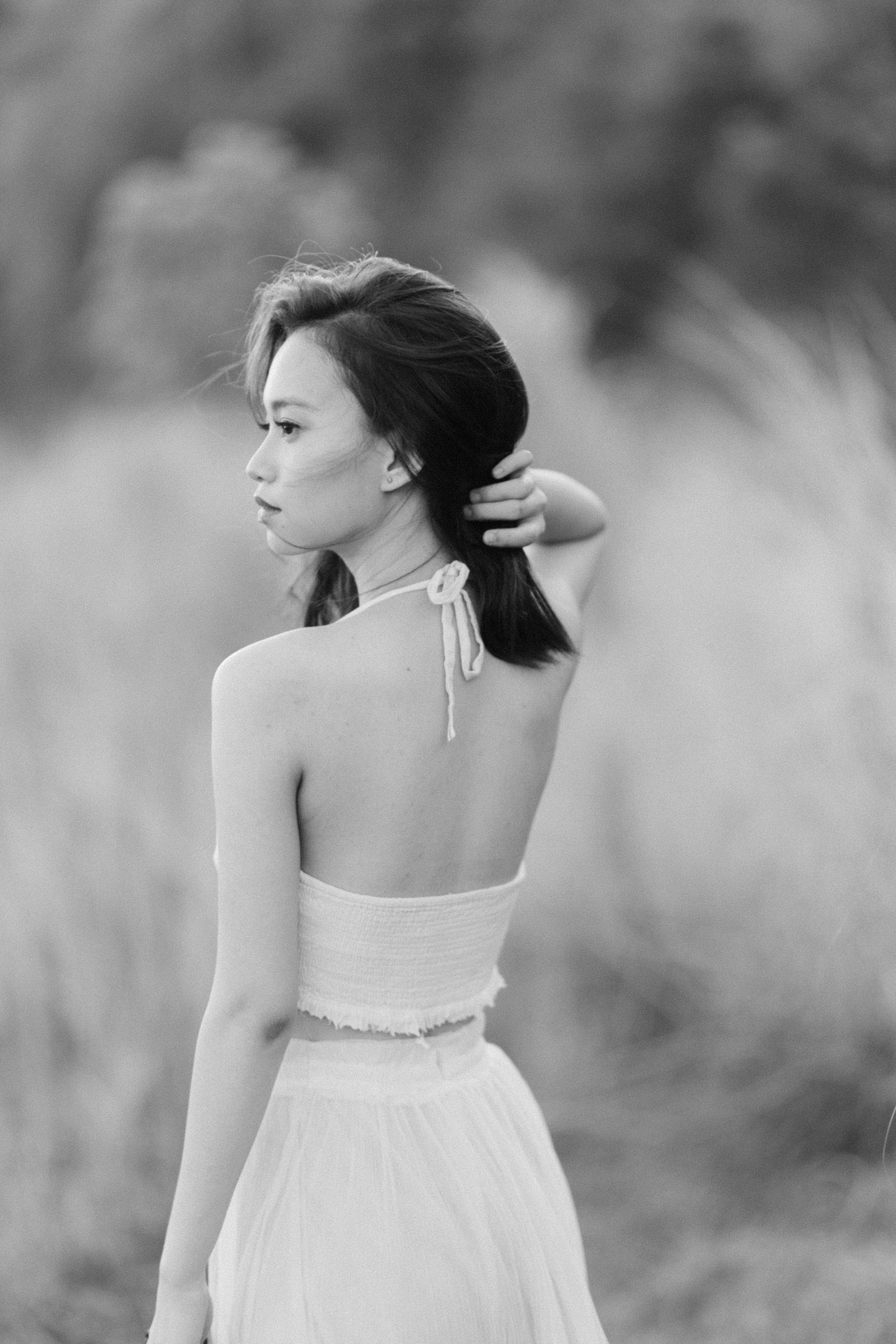 Serene portrait of a woman in nature, highlighting timeless beauty.