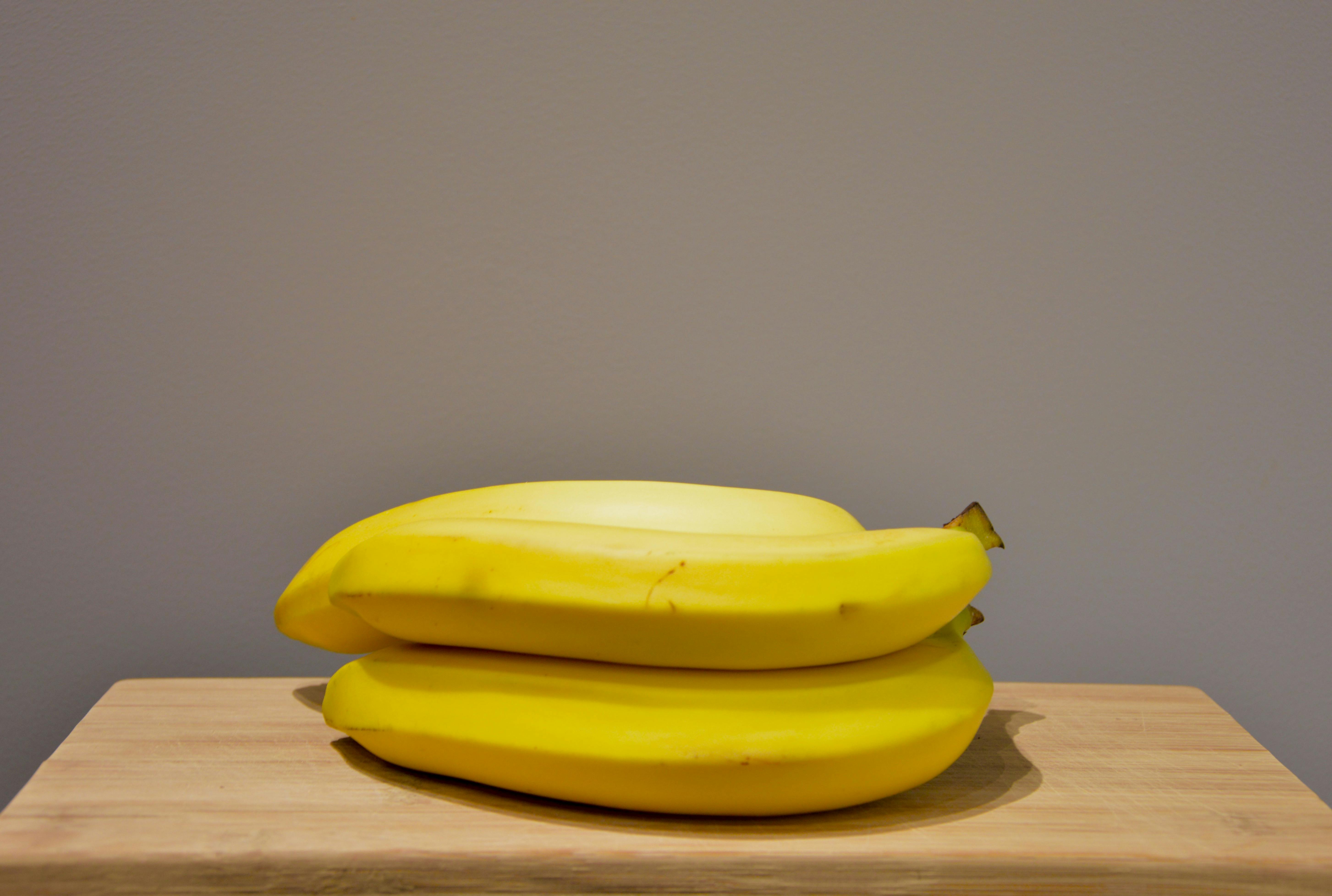 Yellow Bananas on an Oak Wood Table