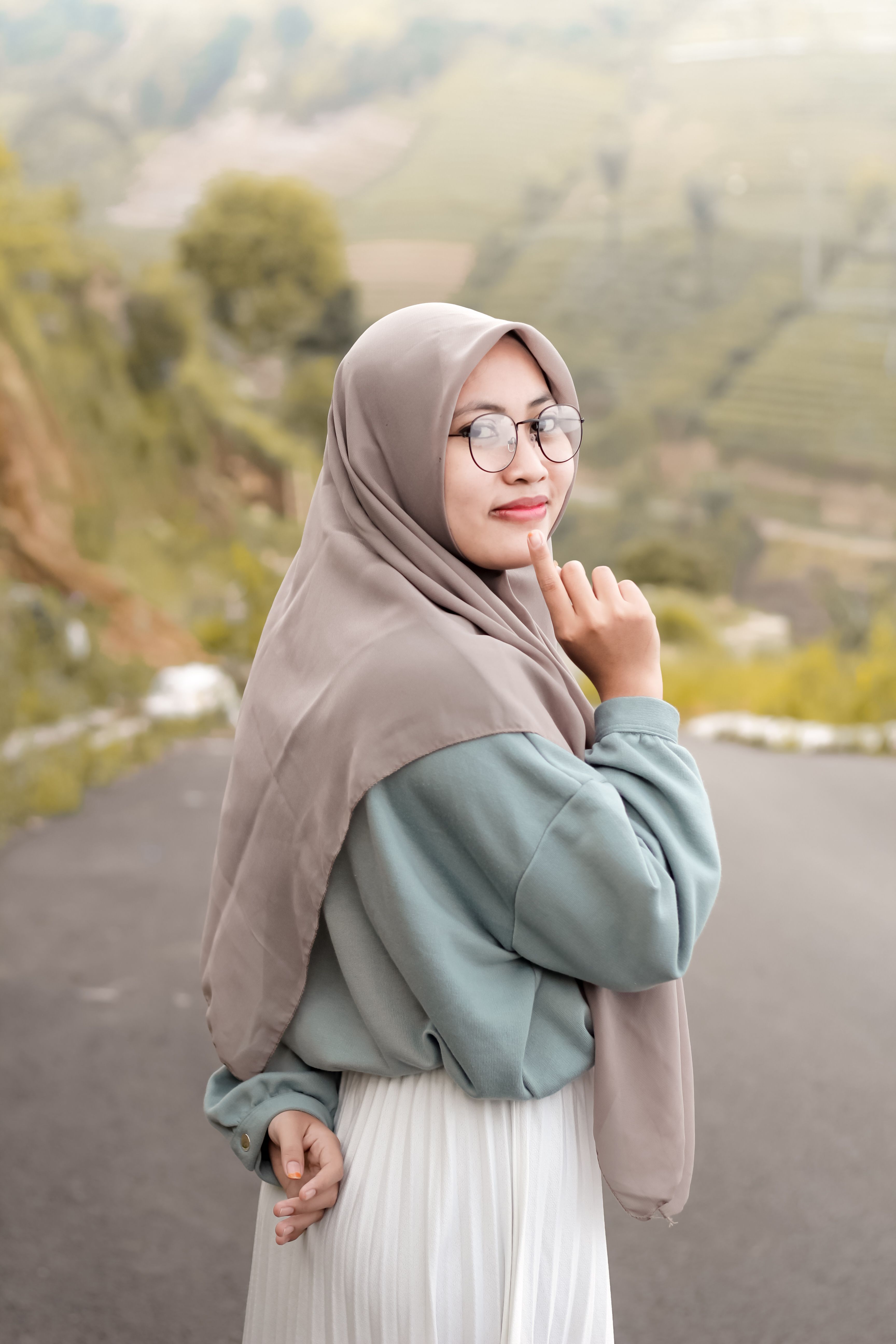 Woman in Brown Hijab and White Brown and White Plaid Long Sleeve Shirt ...