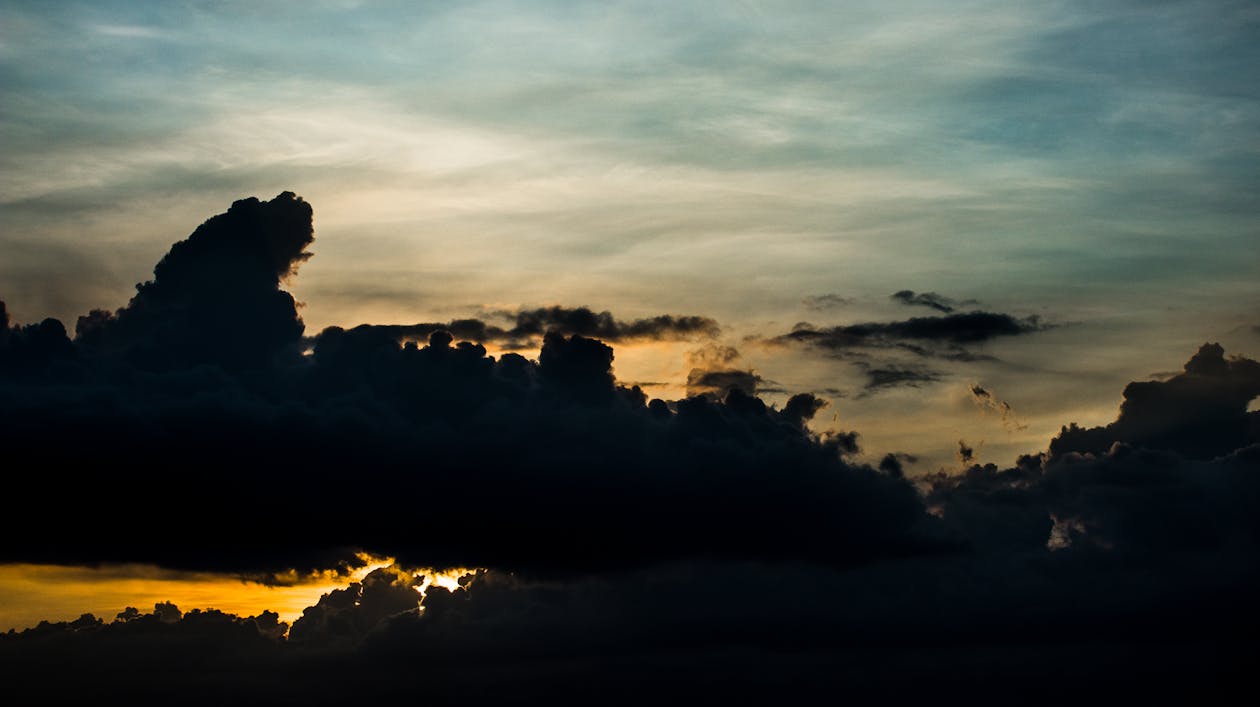 Sunset Behind Very Dark Clouds 