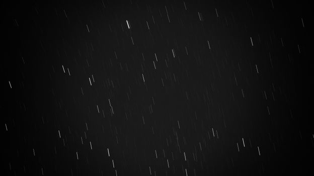 Black and white long exposure photograph of star trails creating a mesmerizing pattern.