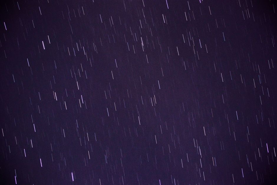 Long exposure capturing vibrant star trails creating a dynamic night sky display.