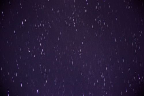 Free Long exposure capturing vibrant star trails creating a dynamic night sky display. Stock Photo