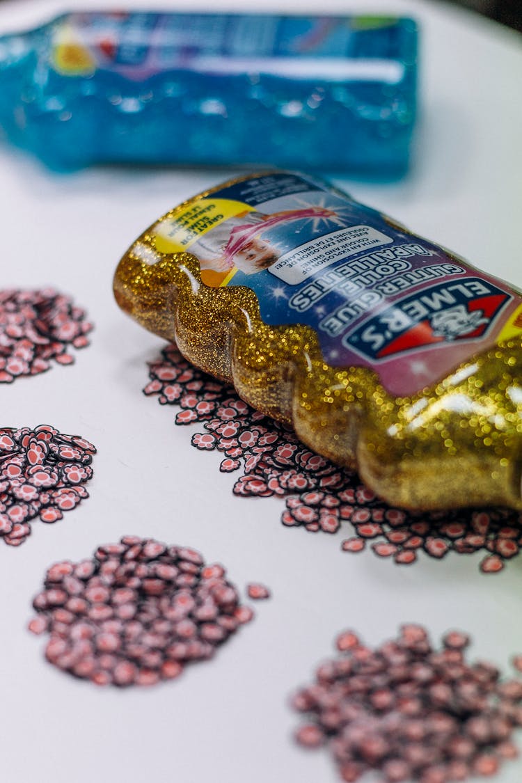 Close-up Of Bottles Of Craft Glue And Little Stickers 