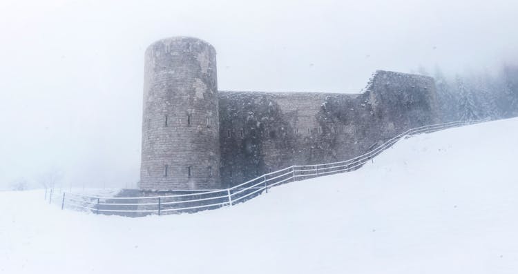 Gray Castle On Snowy Place