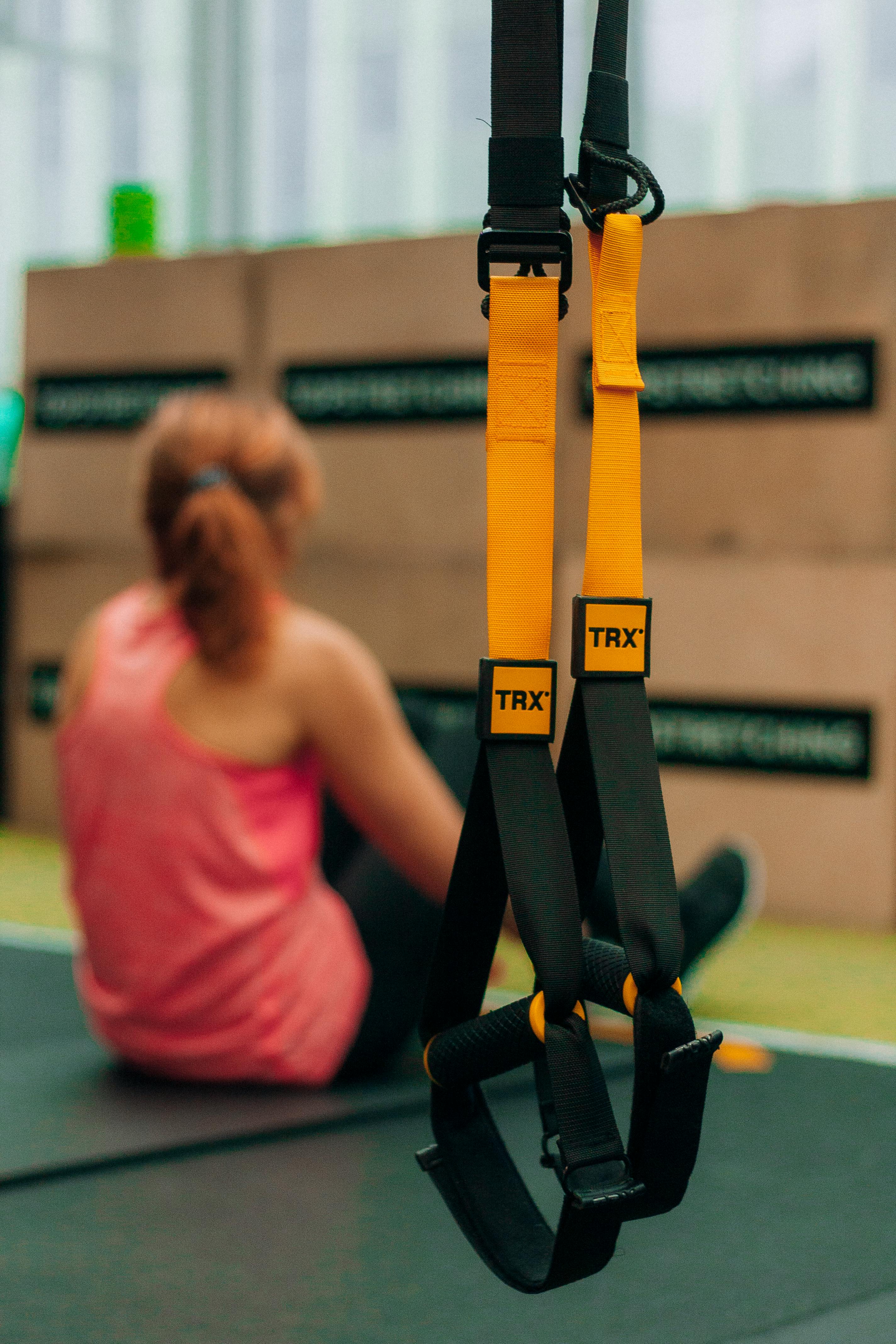 Hanging Orange and Black Exercise Straps · Free Stock Photo