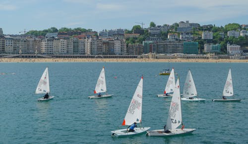 Identical Sailboats at Sea