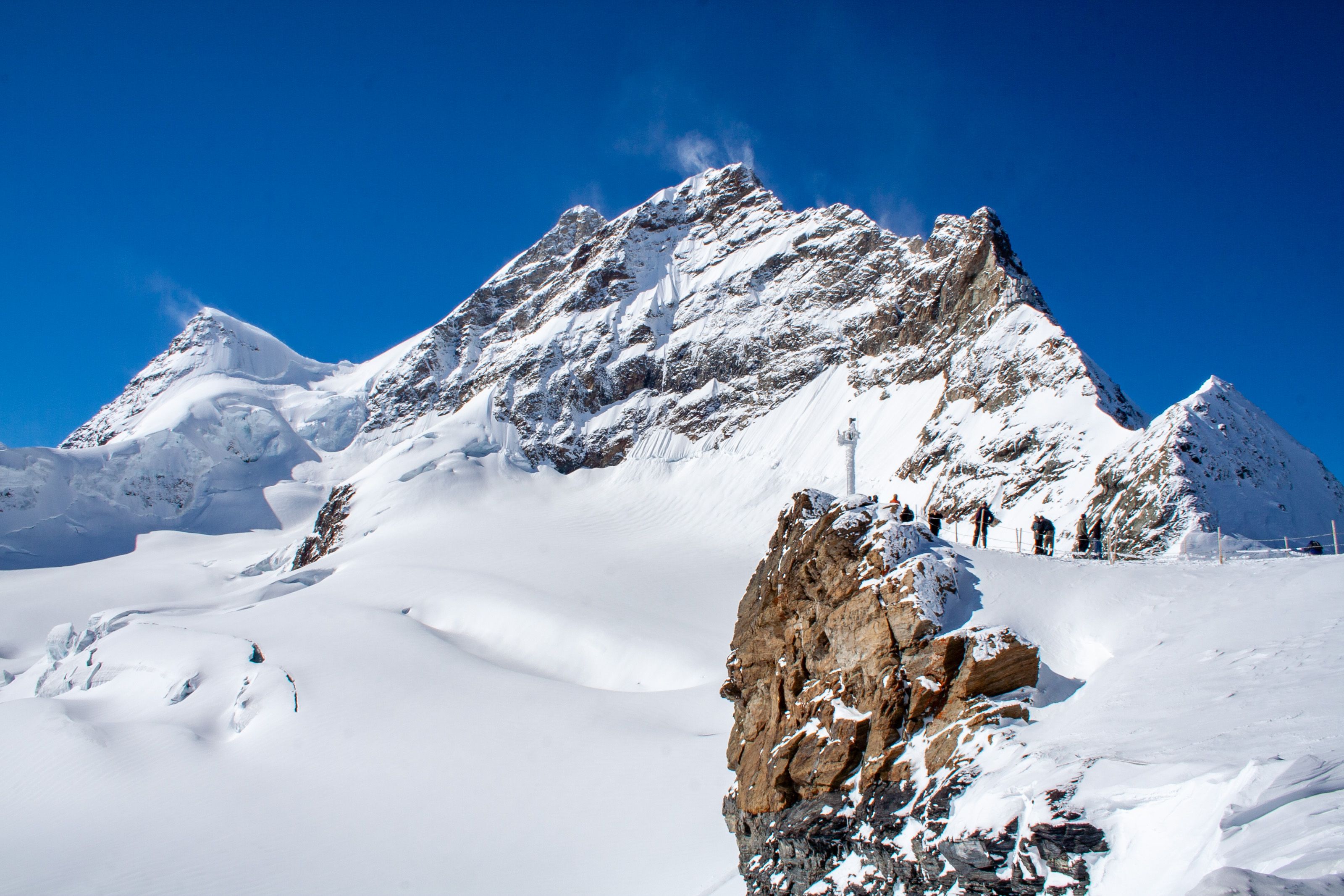 Tourists enjoying the view from Jungfraujoch 'Top of Europe' in Switzerland
