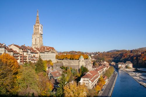 Free Panoramic view of Bern, Switzerland featuring the cathedral, autumn foliage, and the river Aare. Stock Photo