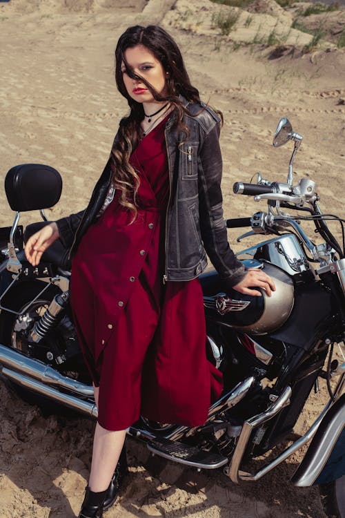 

A Woman Leaning on a Motorcycle