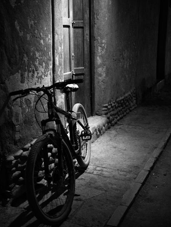 A Grayscale of a Parked Bicycle · Free Stock Photo
