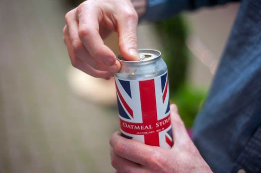 Close-up of Man Opening a Beer Can 