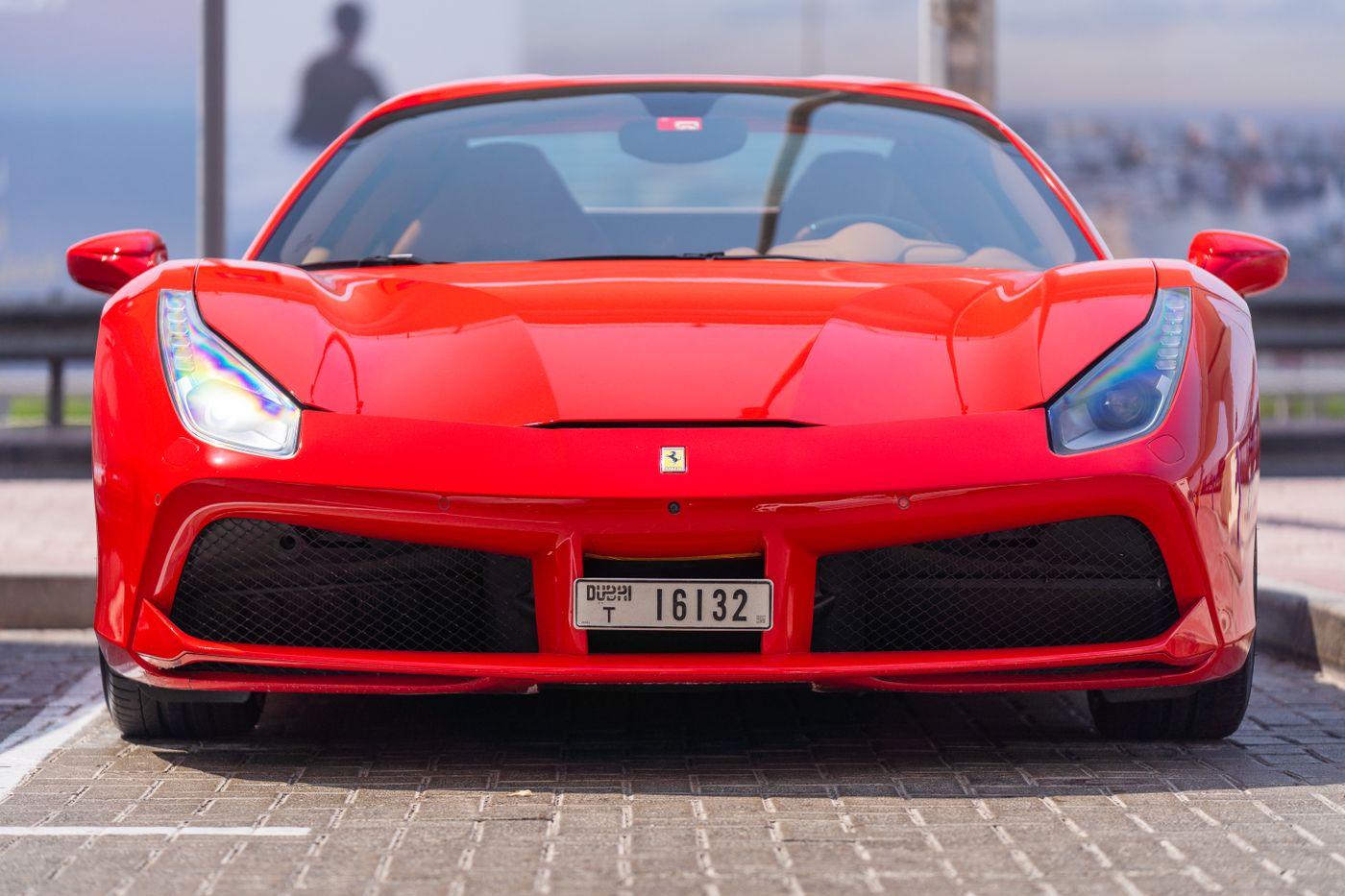 The same sports car looking clean and glossy after detailing