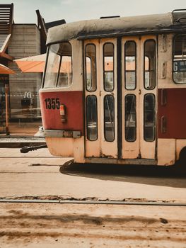 A classic red and white tram number 1355, captured in a city setting with vintage charm.
