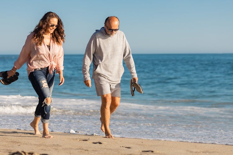 A Man And A Woman At The Beach 