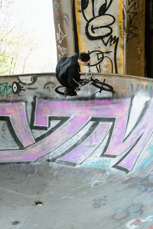 Man in Black Clothes Riding Bike on Ramp 