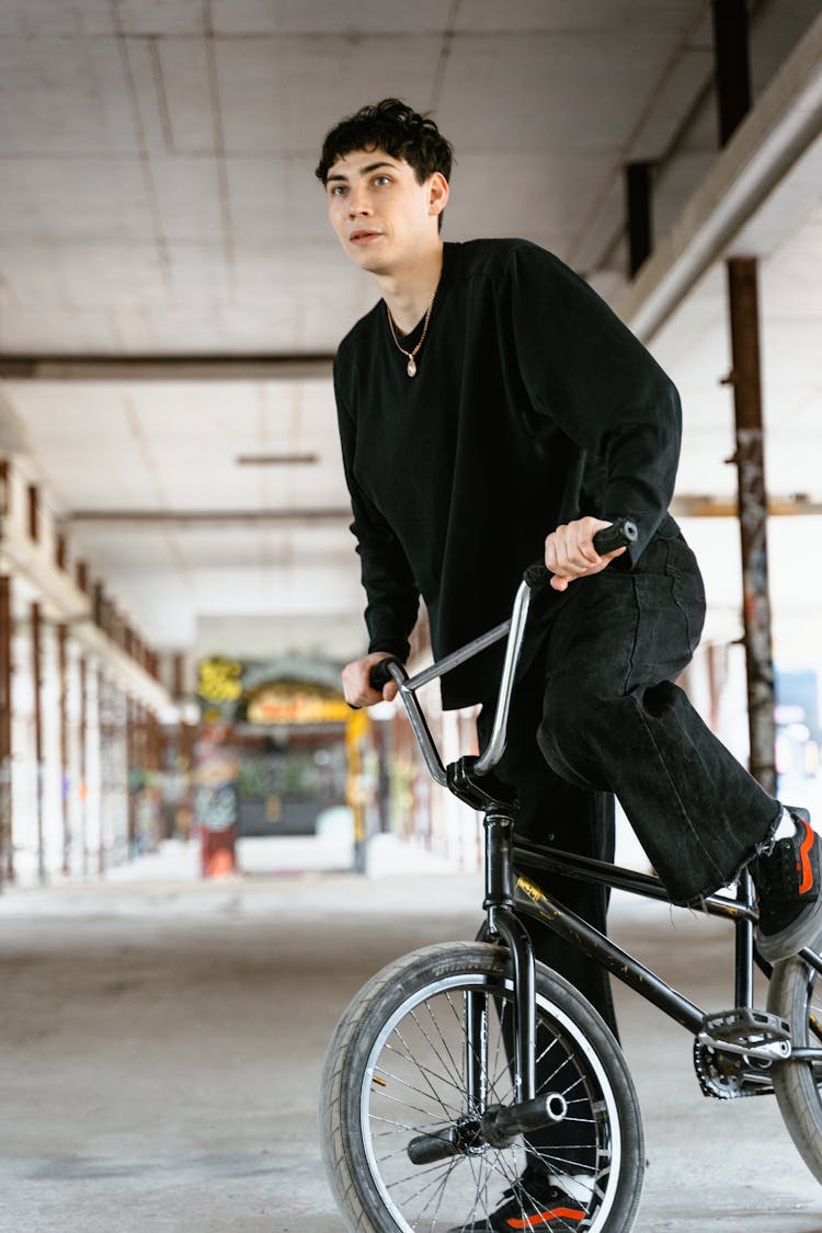 Man On A Bike In A Construction Site