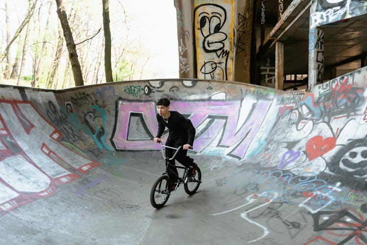 Man Riding A Bike On A Ramp