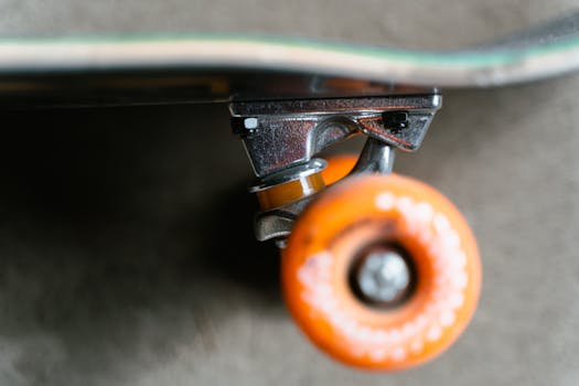 Detailed shot of a skateboard wheel and truck showing depth and focus.