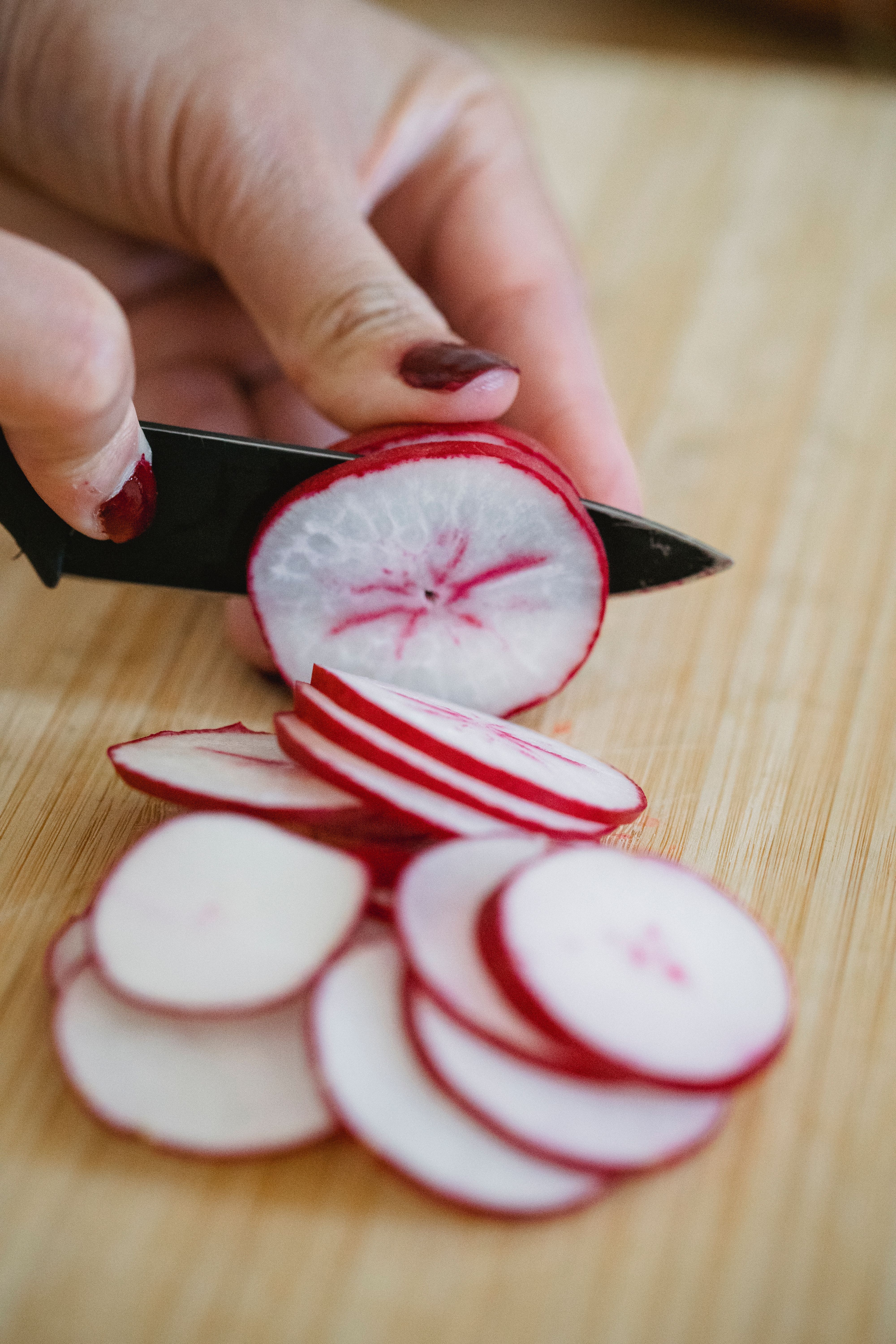 A Person Slicing Radish · Free Stock Photo