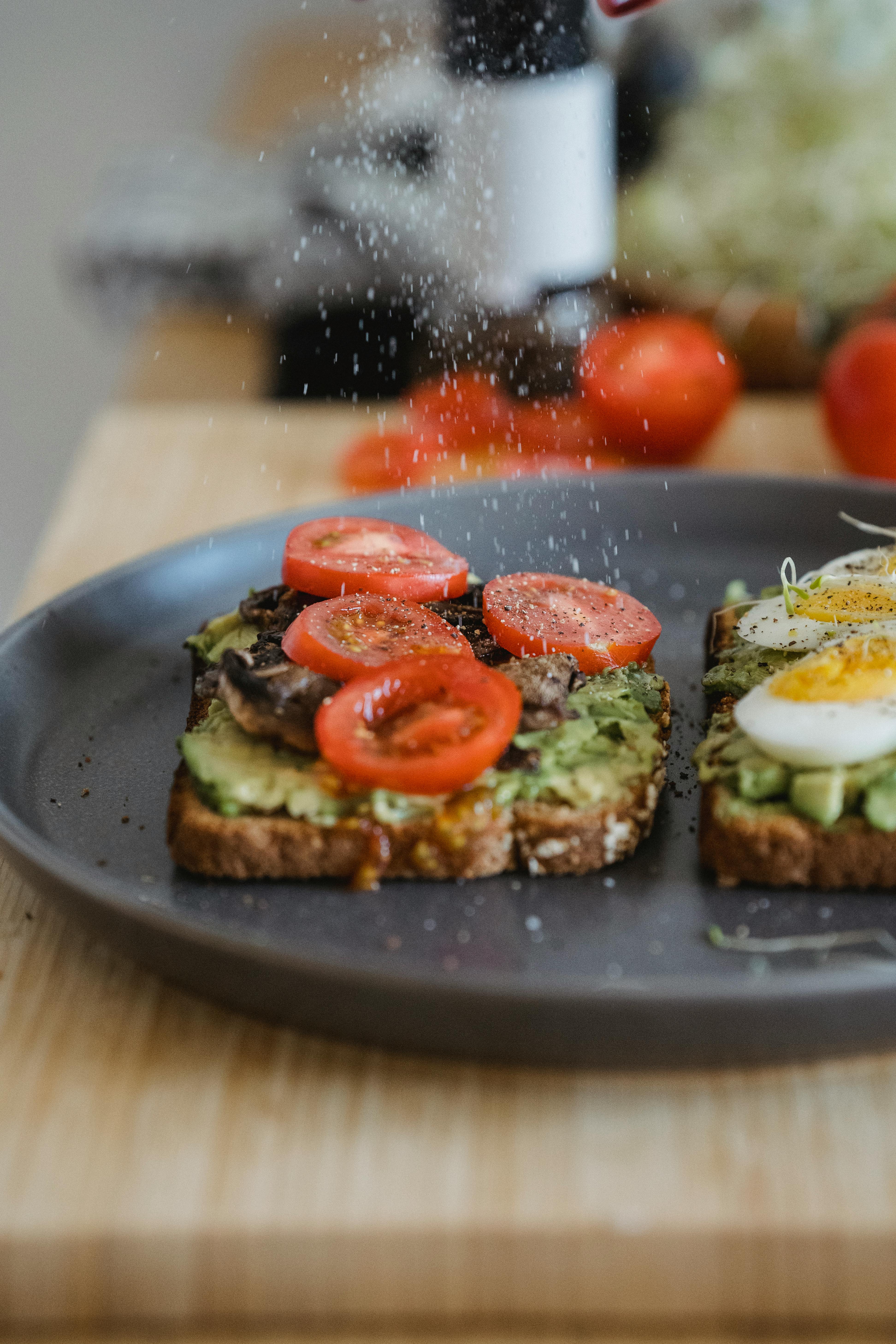 dash of salt over avocado toasts